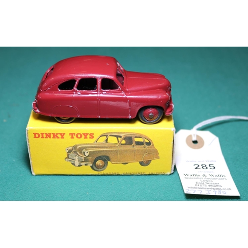 285 - Dinky Toys Standard Vanguard (153). A scarce example in maroon with maroon ridged wheels and black r... 