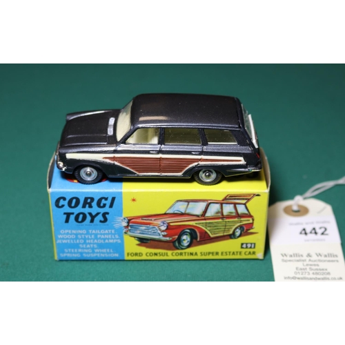 442 - Corgi Toys Ford Consul Cortina Super Estate Car (491). An example in metallic dark grey with wood ef... 