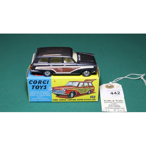 442 - Corgi Toys Ford Consul Cortina Super Estate Car (491). An example in metallic dark grey with wood ef... 