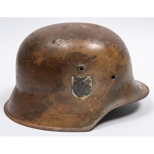 158 - The skull only of a German M42 steel helmet, with traces of camouflage finish and single mostly obli... 