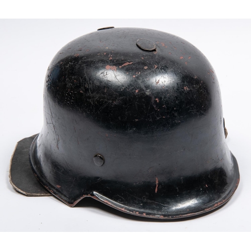 160 - A late WWII or post war German Fire Service helmet, similar to M1935 helmet with leather neck curtai... 