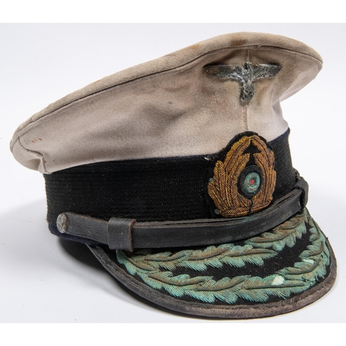 168 - A  well made copy of a Third Reich Naval officer's peaked cap, white top, gilt bullion embroidered p... 