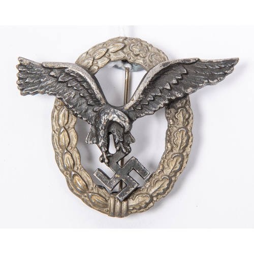 116 - A Third Reich Luftwaffe Pilot's badge, with matt silver wreath and black eagle, the reverse with mak... 