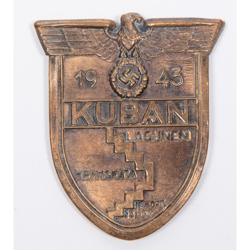 128 - A Third Reich 1943 Kuban Shield, with copper washed finish, 4 band over blades, and steel backing pl... 