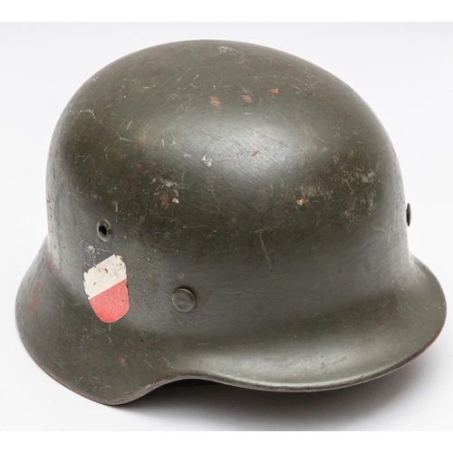156 - A Third Reich M1936 steel helmet army model, field grey with both decals, leather lining and chin st... 