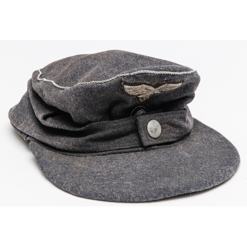 161 - A Third Reich Luftwaffe officer's field cap, badges and braid trim of silver alloy. GC £250-300