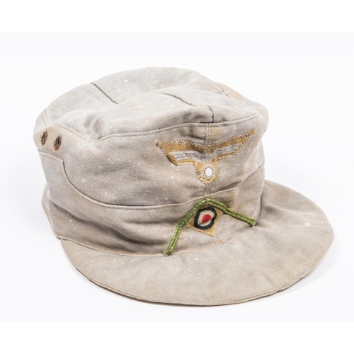 165 - A Third Reich Afrika Corps field cap, with Bevo type woven insignia, marked inside 