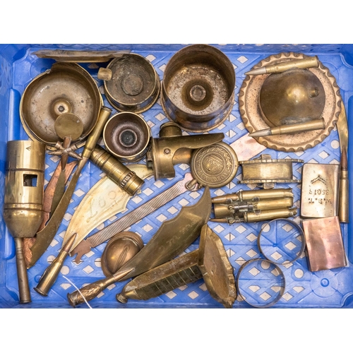 38 - A collection of WWI trench art items, mostly brass, comprising: 7 paper knives, 2 cigarette lighters... 