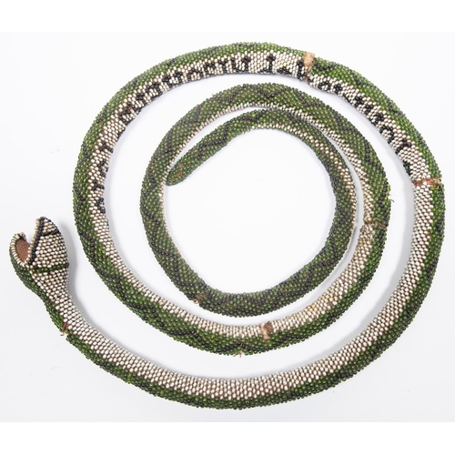 39 - A WWI Turkish Prisoner of War beadwork snake, length over 6 feet extended, covered with green and wh... 