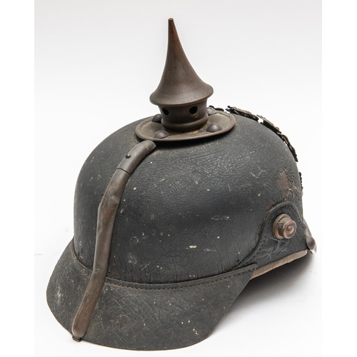 152 - A WWI Bavarian pickelhaube, with brass mounts, leather liner, and traces of maker's stamp inside the... 