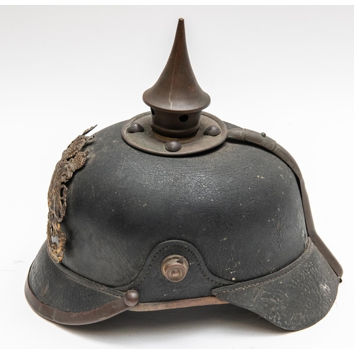 152 - A WWI Bavarian pickelhaube, with brass mounts, leather liner, and traces of maker's stamp inside the... 