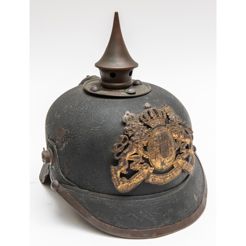 152 - A WWI Bavarian pickelhaube, with brass mounts, leather liner, and traces of maker's stamp inside the... 