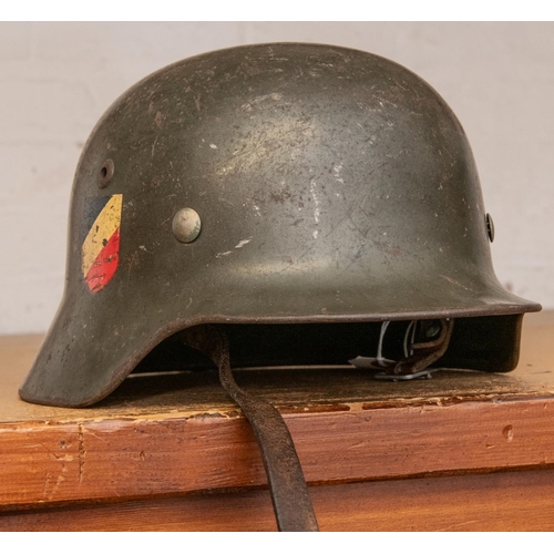 154 - A good Third Reich M1935 Army helmet, retaining most of original finish and decals, leather lining a... 