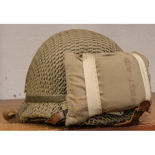 398 - A good WWII US Airborne Forces MI helmet, complete with liner, Airborne chinstrap with cup, fixed Ba... 