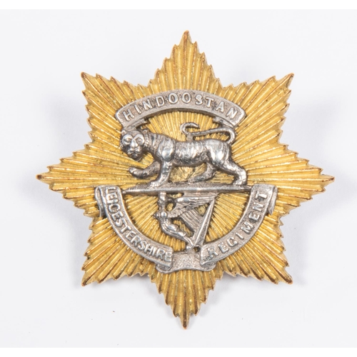 240 - A good pre 1895 officers star pattern cap badge of the Leicestershire Regt, consisting of gilt star ... 