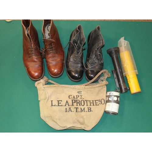 386 - A pair of brown leather marching boots, a pair of ammuntion boots, a brass signalling torch, also ot... 