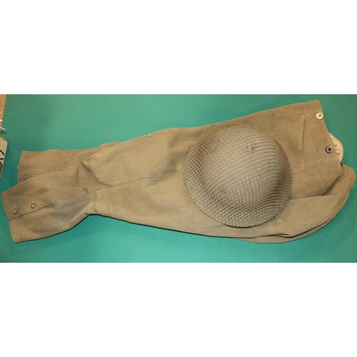 395 - A WWII steel helmet, a khaki blanket, a pair of breeches, and 2 WWII respirator haversacks. GC £70-1... 