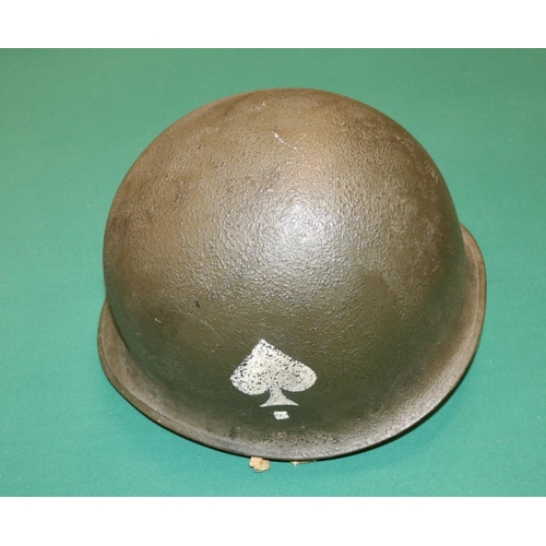 399 - A WWII US M1 steel helmet, Airborne Troops liner, with leather chin cup, netting cover with field dr... 