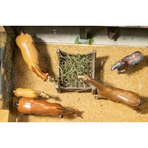 108 - Britains stable yard diorama bespoke and well made and containing a wooden stable, a hay wagon, 2 pl... 