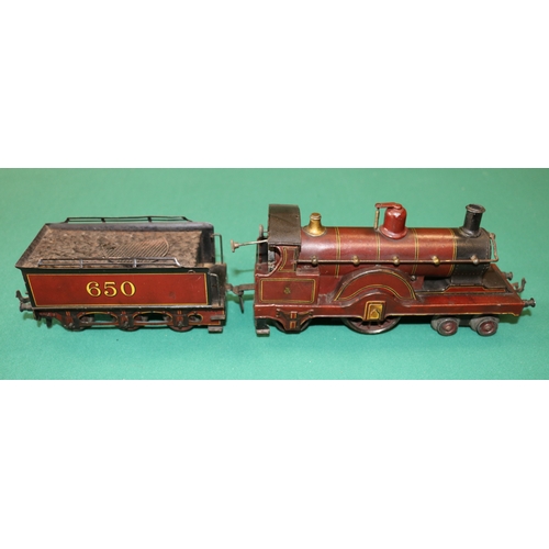 211 - A rare early Bing O Gauge clockwork 4-2-2 tender locomotive. In the style of a Johnson Single with a... 