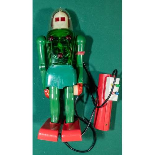 237 - Dux Astroman Electric Robot toy. Comes with remote control. Robot has a clear green plastic body wit... 