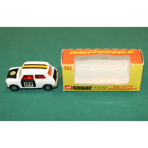 416 - Corgi Toys Whizzwheels Mini-Cooper (282). In white with black bonnet, doors and boot lid, with red i... 