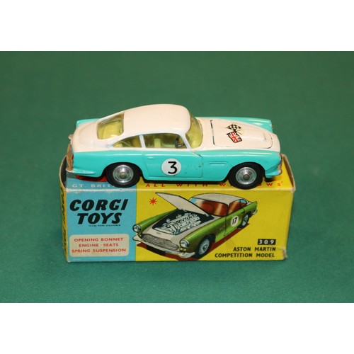 376 - Corgi Toys Aston Martin Competition Model (309). In white and turquoise, with crossed flags to bonne... 