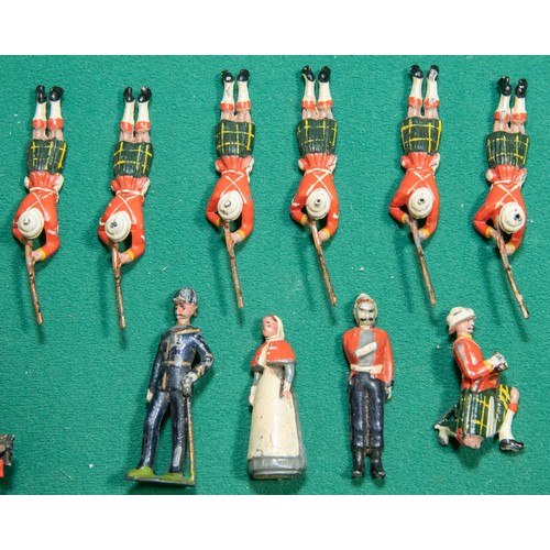 80 - 22 Lead and white metal figures, Including 7 Scottish Regiment riflemen laying down with rifles draw... 