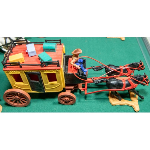 96 - 6 plastic Timpo wagons, to include, Clay County Jail wagon, with Horse and Figures, 2 Covered wagons... 