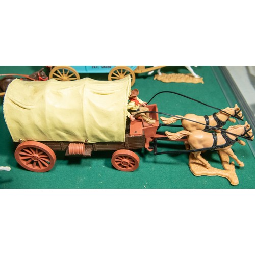 96 - 6 plastic Timpo wagons, to include, Clay County Jail wagon, with Horse and Figures, 2 Covered wagons... 