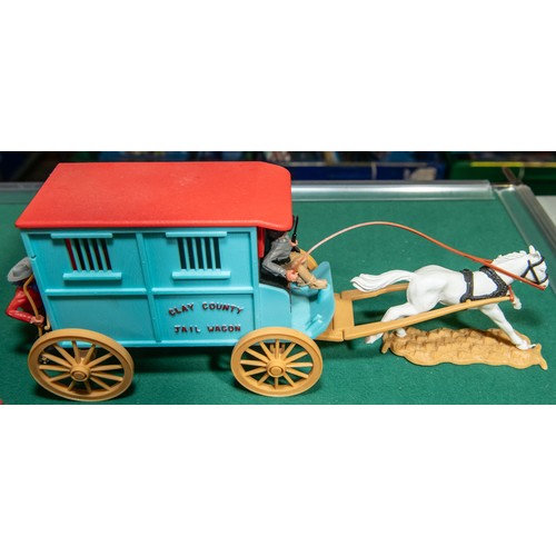 96 - 6 plastic Timpo wagons, to include, Clay County Jail wagon, with Horse and Figures, 2 Covered wagons... 