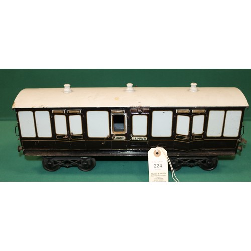 224 - A rare Bing Gauge 3 L&NWR bogie Guards Van. 43cm, buffer to buffer, in lined dark brown and white li... 