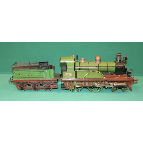 227 - A rare Bing gauge 3 spirit fired GNR 4-4-0 tender locomotive. C.1902 Locomotive 39cm, 6 wheeled tend... 