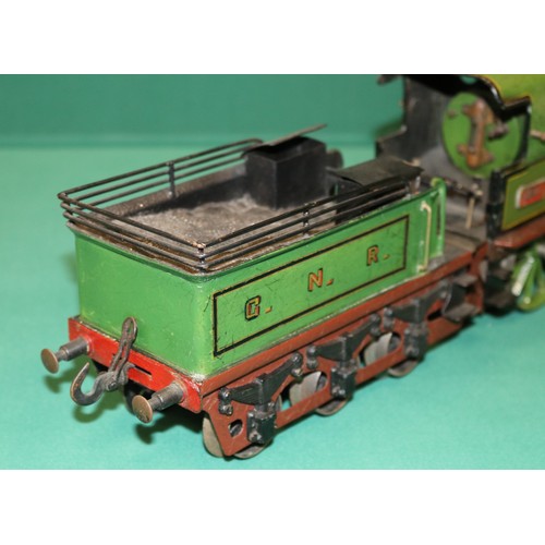 227 - A rare Bing gauge 3 spirit fired GNR 4-4-0 tender locomotive. C.1902 Locomotive 39cm, 6 wheeled tend... 