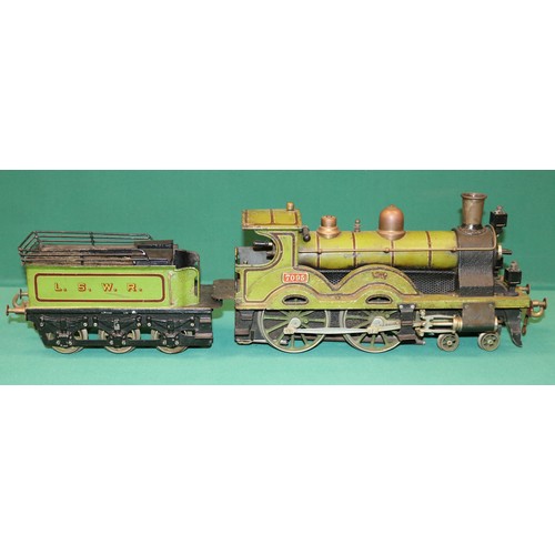 228 - A rare Bing gauge 3 spirit fired LSWR 4-4-0 tender locomotive. C.1902 Locomotive 39cm, 6 wheeled ten... 