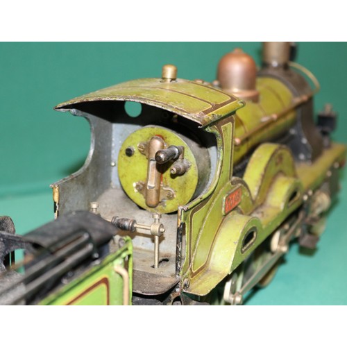 228 - A rare Bing gauge 3 spirit fired LSWR 4-4-0 tender locomotive. C.1902 Locomotive 39cm, 6 wheeled ten... 