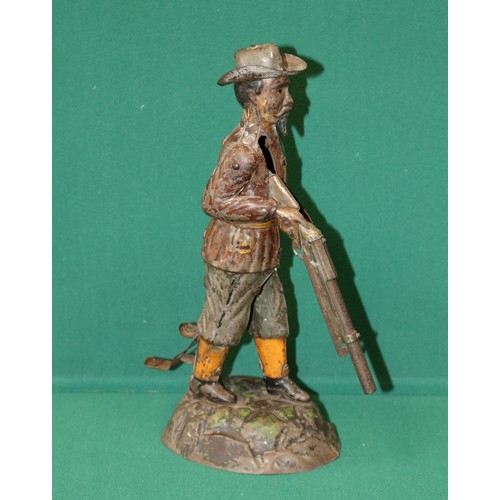 246 - Tinplate Model of what looks to be a hunter dressed in a brown jacket with grey trousers, Orange and... 