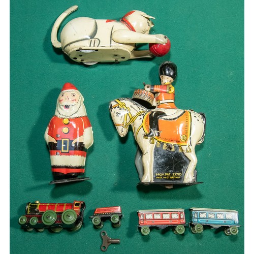 248 - 4 vintage Clockwork tinplate toys. Wells Brimtoy Santa Clause with walking action, Drummer on horseb... 