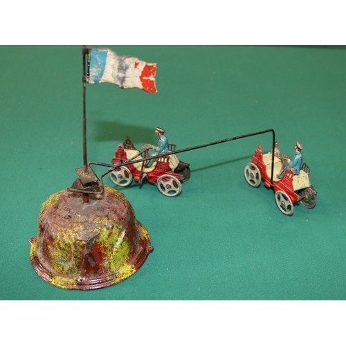 265 - A rare early 1900s clockwork tinplate toy possibly by Meire, Made in Germany. Consists of 2 Penny to... 