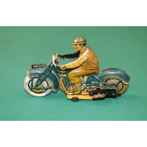 277 - Tipp & Co, T686 tinplate Motorcycle made in the 1930s  Tin-plate litho is in good condition. Clockwo... 