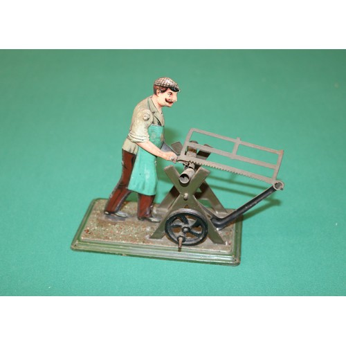 286 - Bing, Made in Germany  C.1912 -1914, tin-plate toy of a man sawing a metal bar with a bow saw, This ... 