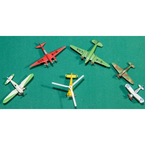 299 - 6 Dinky toys miniature Aeroplanes, Possibly dating from 1930s - 1940s. Includes Spitfire, Biplane, i... 