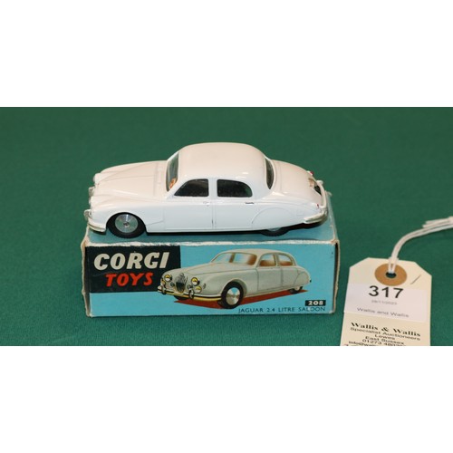 317 - Corgi Toys Jaguar 2.4 Litre Saloon (208). Example in white with smooth spun wheels and black rubber ... 