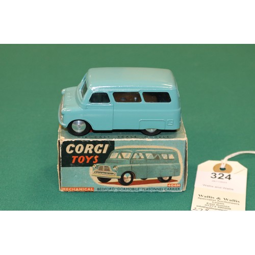 324 - Corgi Toys Bedford Dormobile Personnel Carrier (404M). A mechanical example in mid blue with smooth ... 