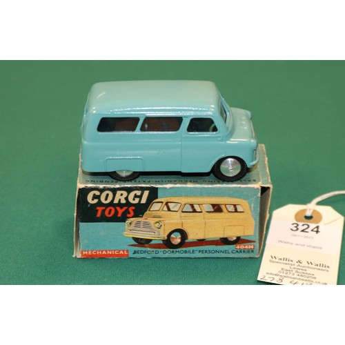 324 - Corgi Toys Bedford Dormobile Personnel Carrier (404M). A mechanical example in mid blue with smooth ... 