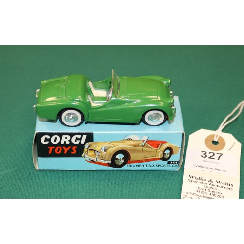 327 - Corgi Toys Triumph TR2 Sports Car (301). An example in dark green with cream seats, smooth spun whee... 