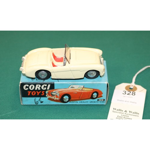 328 - Corgi Toys Austin-Healey Sports Car (300). An example in cream with red seats, smooth spun wheels wi... 