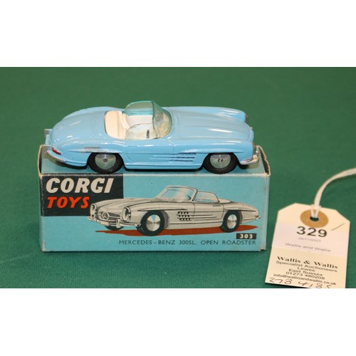 329 - Corgi Toys Mercedes-Benz 300SL Open Roadster (303). An example in light blue with white interior, sm... 