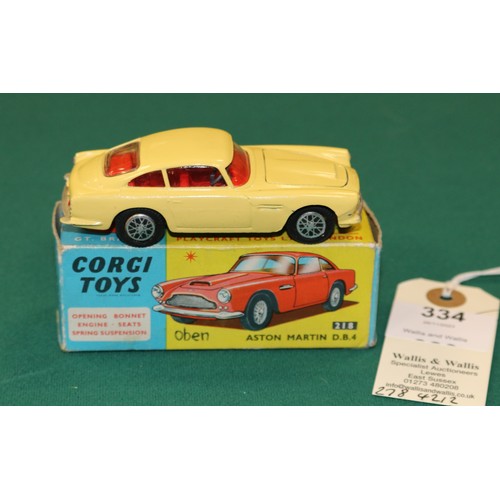 334 - Corgi Toys Aston Martin DB4 (218). An example in yellow with red interior, closed bonnet vent, spun ... 