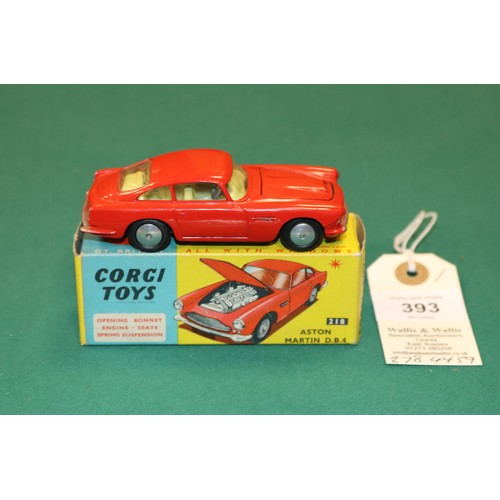 393 - Corgi Toys Aston Martin DB4 (218). An example in red with yellow interior, open bonnet vent, smooth ... 